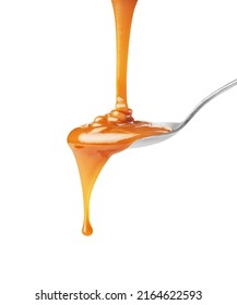  drip of caramel in a spoon on a white background