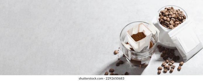Drip Coffee Bag in a Cup, Coffee Trend, Quick Way to Brew Ground Coffee Using Paper Type Filter - Shutterstock ID 2292650683