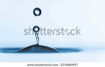 Drip Dynamics: Unveil the dynamic physics at play during a droplet's descent into the water.