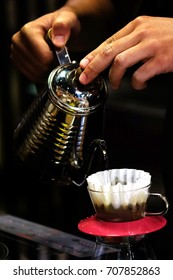 Drip filter coffee action. Brewed coffee is made by pouring hot water onto ground coffee beans, then allowing to brew. There are several methods for doing this, including using a filter.