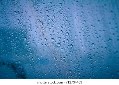 Drip Rain On Widow Car With Dark Season Background.