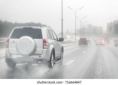 Drive Car In Rain On Asphalt Wet Road. Clouds And Sun