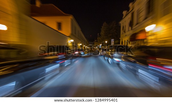 Drive at fast speed at the night streets in\
downtown timelapse hyperlapse drivelapse. Blured road with lights\
on high speed. Prague,\
Czech