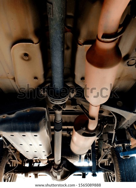 The\
drive mechanism of the car taken from under the\
car