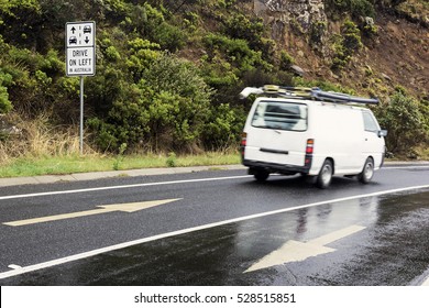 Drive On Left In Australia Sign And The White Camper Van