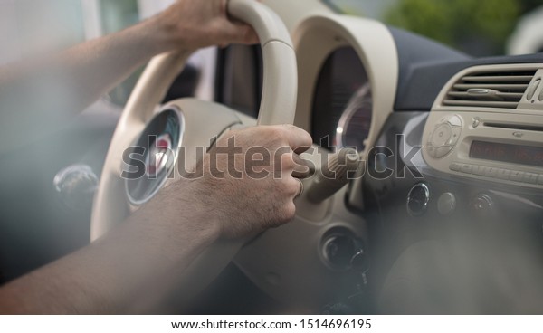 Drive\
safely and carefully. Business man driving\
car.
