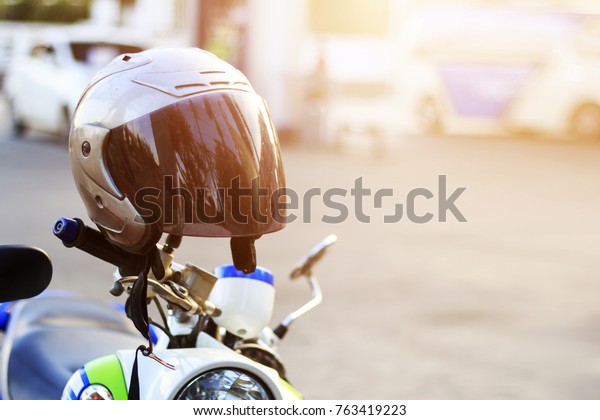 drive safely, wear a helmet concept.\
soft-focus and overlight in the\
background