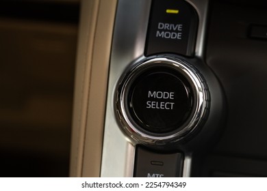 Drive selector button. Car interior, offroad drive controller closeup view. Wheel drive selection. Four-Wheel Drive transmission selection system.  - Shutterstock ID 2254794349