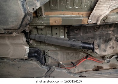 The Drive Shaft Of The Car On The Bottom During The Analysis And Repair Of The Lifted On The Lift In The Workshop For The Repair Of Vehicles. Auto Service Industry.