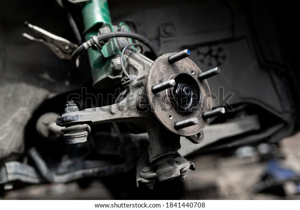Drive shaft of\
car,bearing,wheel bolt and joint of steering rack remove for check\
service work in Garage