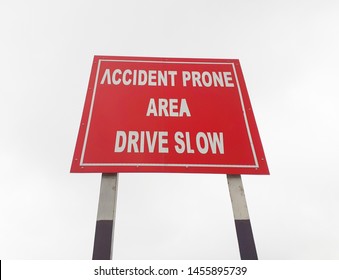 Drive Slow, Accident Prone Area Sign Board On The Highway, Roadside