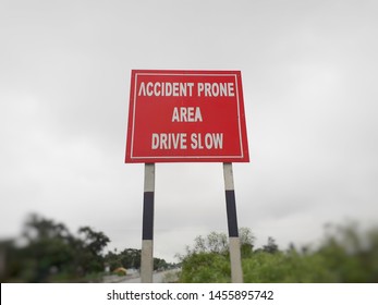 Drive Slow, Accident Prone Area Sign Board On The Highway, Roadside