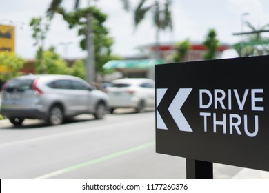 Drive Thru Sign With Blur Car On Background