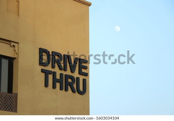 Drive Thru sign board  food ordered from the\
vehicle and collect from the next\
counter