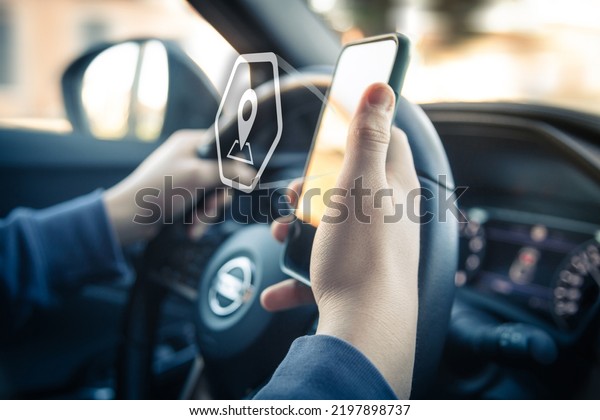 Drive using smartphone.
Automotive technology concept. Infotainment, navigation
communication device