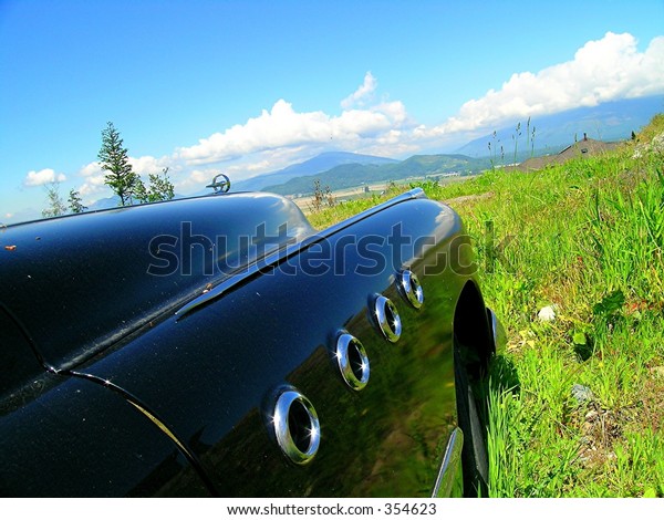 Drive-In reality show.  1949\
Classic car overlooking the Skagit Valley in Northwest Washington\
state.