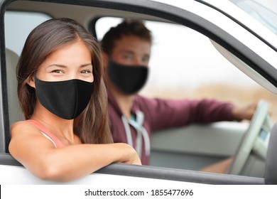 Driver and Asian passenger woman wearing face masks happy portrait in car driving buying new car or instructor with driver for test at driving school.