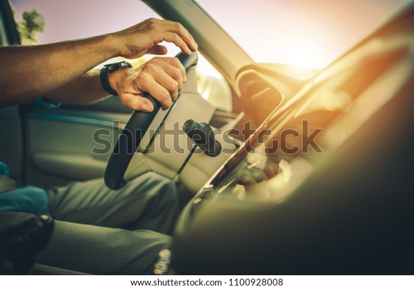 Driver Behind\
the Wheel. Modern Car Driving\
Theme.