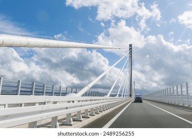 Driver car POV view modern multi-span cable-stayed Peljesac Bridge over  sea in Dubrovnik-Neretva County canal bay.  Suspension bridge architecture engineering construction in Europe. - Powered by Shutterstock