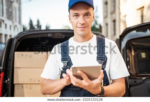 The driver of the courier service delivers food\
and goods to the house.