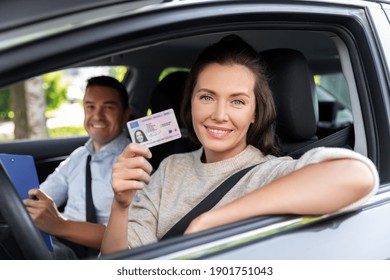 driver courses, exam and people concept - young woman with license and driving school instructor with clipboard in car - Shutterstock ID 1901751043