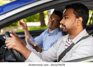 Driver Courses And People Concept - Driving School Instructor Talking To Sad Indian Man Failed Exam In Car