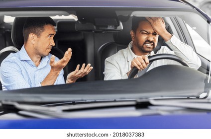 Driver Courses And People Concept - Driving School Instructor Talking To Sad Man Failed Exam In Car