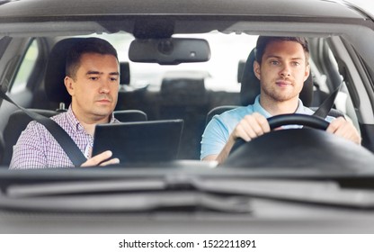 driver courses and people concept - man and driving school instructor with tablet computer in car