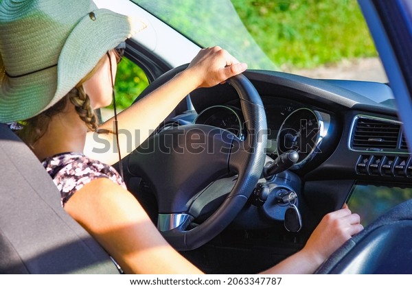 driver driving a car on the\
road