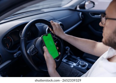 A Driver Engaged with a Smartphone While Navigating Busy Streets: An Insight into Modern Driving Habits and Smartphone Usage in Cars