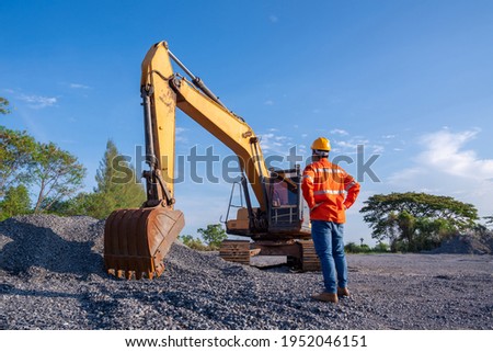 Driver excavator for road construction, Crawler excavator in construction site on blue sky background