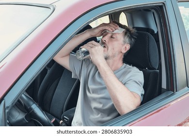 Driver experiencing heatstroke, sweat and dehydration in hot car