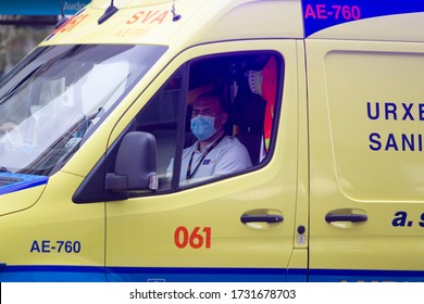 Coruña-Spain.Ambulance Driver With Face Mask Inside The Vehicle On May 10,2020