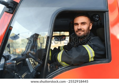 Driver of a fire truck in action.