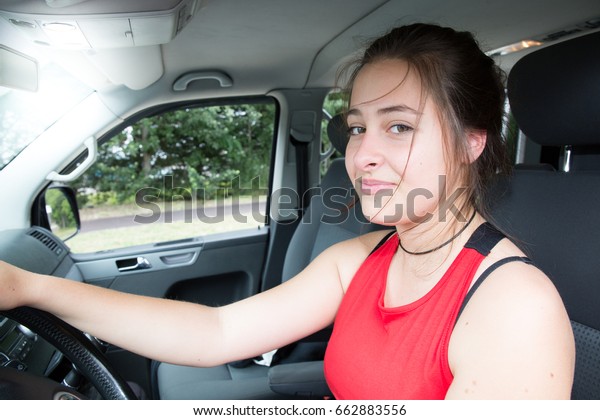 driver girl in van\
or car smiling and happy