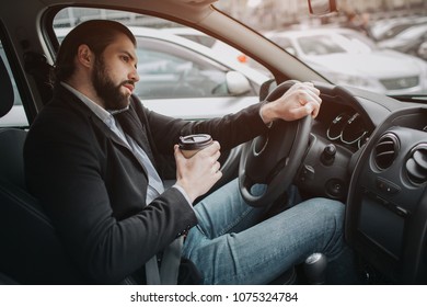 The Driver Going On The Road, Speaking On The Phone, Working With Documents At The Same Time. Businessman Doing Multiple Tasks. Multitasking Business Person.