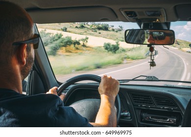 Driver with Hands at the wheel