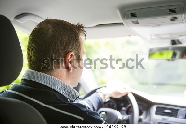 Driver in-car.\
Image taken from the\
backseat.