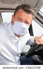 Driver Man In Car With Protective Surgical Mask See Through Window In Corona Virus Protected Person