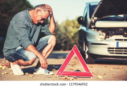 Driver on the road having problem with a car. Cars and transportation concept