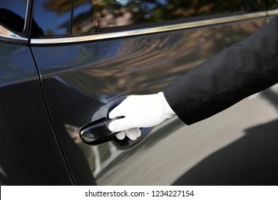 Driver Opening Car Door, Closeup. Chauffeur Service