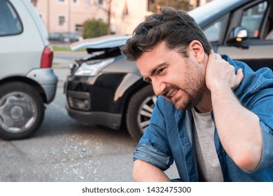 Driver portrait feeling pain after car accident
