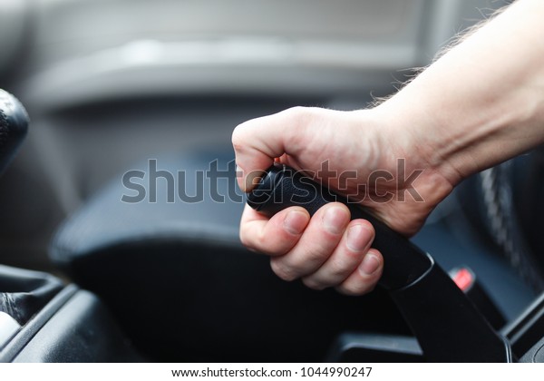 The driver pulls the
hand brake lever. 