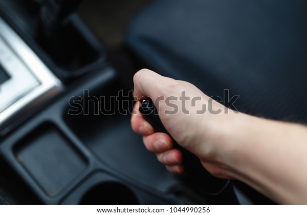 The driver pulls the
hand brake lever. 