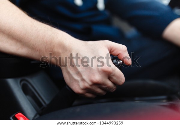 The driver pulls the\
hand brake lever.