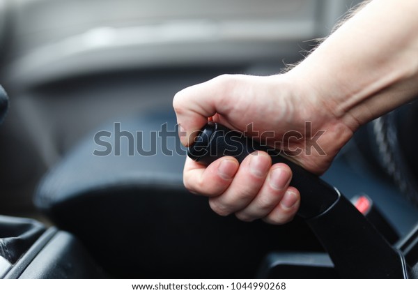The driver pulls the\
hand brake lever. 