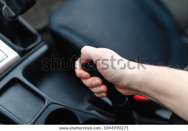 The driver pulls the\
hand brake lever. 