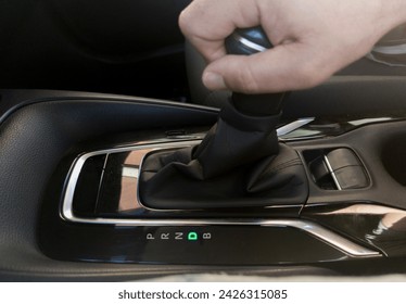 Driver driver putting D gear. Gear selector for an automatic transmission car