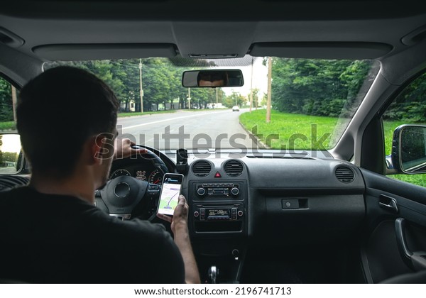 A driver rides through the streets of the city\
and a navigator.