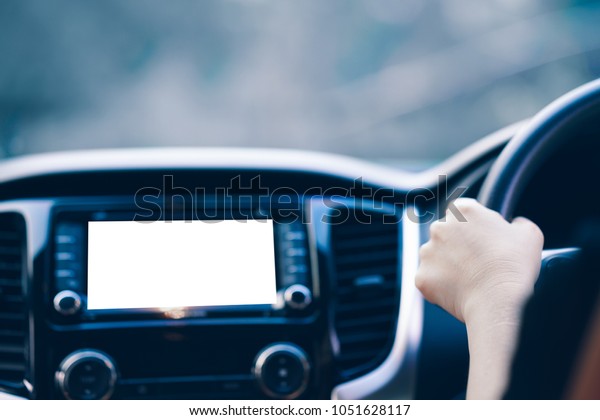 Driver with screen of navigation device inside\
a car dashboard